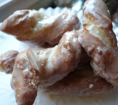 several glazed donuts stacked on top of each other