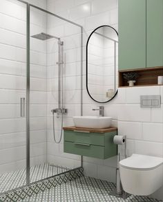 a bathroom with green and white tiles on the floor, sink, toilet and shower