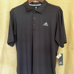 Adidas Mens Golf Polo. Color Black. Size Medium. Fabric Content 93/7 Polyester/Spandex, Features 50 Spf. Lightweight And Cool For Summer. Cheap Polo Collar T-shirt For Sports, Cheap Polo Collar Sports T-shirt, Black Moisture-wicking Polo Shirt For Sports, Green Polo Shirts, Moisture-wicking Polo Collar Golf Shirt, Black Polo, Moisture-wicking Polo Collar Golf T-shirt, Adidas Shirt, Yellow Shorts