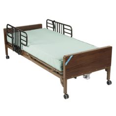 a hospital bed with wheels and rails on the bottom half is shown in this image