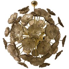 a golden chandelier with leaves and birds on it