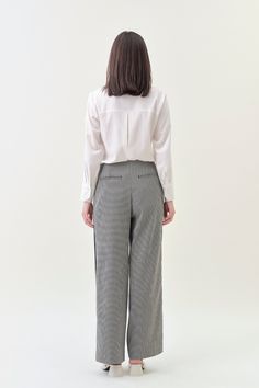 Combining classic tailoring with modern details, our Pleated Wide Pant offers an effortlessly sophisticated silhouette. With a comfortable mid-rise and a pleated wide fit, pair it with our Classic Blazer for a luxe statement. Details Hidden hook-and-bar closure Comfortable mid-rise Wide trouser fit, regular length Side pockets Contrast stripe detail Houndstooth suiting fabric upcycled from premium deadstock Machine washable Classic Tailoring, Suiting Fabric, Wide Trousers, Classic Blazer, Wide Pants, Cardigan Coat, Active Wear Tops, Denim Pants, Cotton Twill