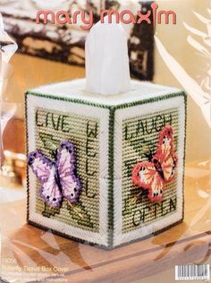 a cross stitch tissue box with two butterflies on it