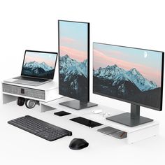 three computer monitors sitting next to each other on top of a white desk with keyboard and mouse