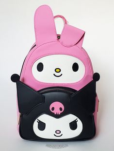 This is a Loungefly Hello Kitty - My Melody and Kuromi mini backpack.  This smooth and supple leather backpack features My Melody and Kuromi cosplay characters in pink and black with glitter and embroidered faces.  The backpack is lined in pink fabric with a print of My Melody and Kuromi.  A zippered pouch reside behind Kuromi and convenient drop pockets are on each side.  The padded shoulder straps are adjustable and the sturdy hardware is gold chrome.  A beautiful backpack!  Check out our list Kuromi Cosplay, Kuromi Outfit, Sanrio Room, Embroidered Faces, My Melody And Kuromi, Black With Glitter, Loungefly Hello Kitty, Beautiful Backpacks, My Melody Kuromi