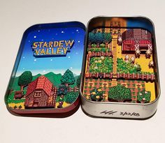 two tins filled with food sitting on top of a white table next to each other