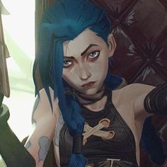 a woman with blue hair and piercings sitting in a chair next to a window