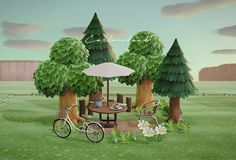 there is a picnic table and two bikes in the grass next to trees with an umbrella over them