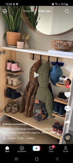 an open shelf filled with shoes next to a mirror