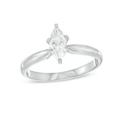 a white gold ring with an oval cut diamond