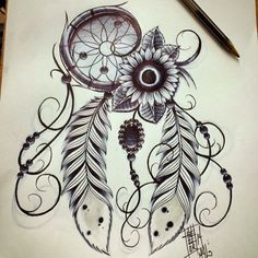 a drawing of a sunflower with feathers and a clock in the middle on paper