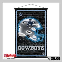 a sign that says cowboys with a football helmet on it and the word cowboys written in blue