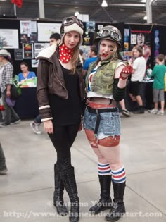 two women dressed up as bikers posing for the camera