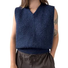 Vintage Mens Eddie Bauer Navy Blue 100% Wool Ribbed Preppy Sweater Vest Sz L Unisex  Size L Color: navy blue  Material: 100% wool Excellent vintage condition  Collar to hem: 26'  Pit to pit: 22"  Modeled on a medium/size 6/ 5 foot 7/ 140lbs/ 34 C/ 28" inch waist Blue Knit Vest For Fall, Navy Wool Tops For Fall, Blue Sweater Vest For Fall, Navy Wool Winter Tops, Classic Blue Sweater Vest For Winter, Classic Blue Winter Sweater Vest, Navy Wool Sweater For Fall, Blue Wool Vest For Winter, Navy Casual Sweater Vest For Fall