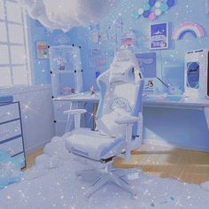 a child's bedroom decorated in blue and white with stars on the ceiling, bedding and desk