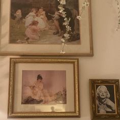 three framed pictures hang on the wall next to each other with flowers in vases