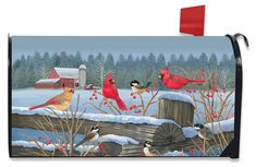 a mailbox cover with birds on it in the snow and red berries around them