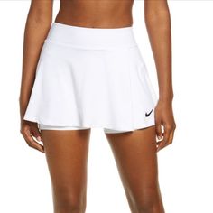 Sporty Style Meets High-Performance Design In This Powerhouse Skort Cut From Sweat-Wicking Dri-Fit Stretch Fabric To Keep You Cool And Comfortable. A Swingy Silhouette Lets You Move Naturally, While Sleek Inner Shorts Provide Coverage And Support You Need From The Pickleball Court To The Tennis Court. 13" Length; 4" Inseam; 16 1/2" Leg Opening (Size Medium) Elastic Waist Built-In Shorts Dri-Fit Moisture-Wicking Technology 88% Polyester, 12% Spandex Machine Wash, Tumble Dry Imported Item # 662574 Fitted White Tennis Shorts, White Fitted Athleisure Skort, White Fitted Tennis Skirt Athleisure, White Fitted Tennis Skirt In Athleisure Style, White Tennis Shorts, White Fitted Tennis Skirt For Athleisure, White Tennis Bottoms With Built-in Shorts, Fitted White Tennis Bottoms, Fitted White Bottoms For Tennis