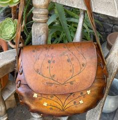 Bohemian Satchel Saddle Bag With Adjustable Strap, Bohemian Saddle Bag Satchel With Adjustable Strap, Bohemian Brown Saddle Bag For Festivals, Bohemian Saddle Bag With Adjustable Strap, Bohemian Hand Tooled Satchel For Festival, Bohemian Brown Shoulder Bag, Bohemian Hand Painted Shoulder Bag For Everyday Use, Handmade Bohemian Saddle Shoulder Bag, Bohemian Hand Tooled Leather Satchel