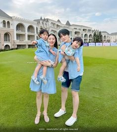 the family is posing for a photo on the golf course