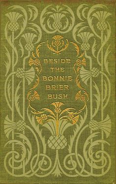 an old book with gold lettering on the cover and ornate designs in green, yellow and orange