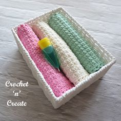 crochet in a crate with a green and yellow toothbrush sitting inside it