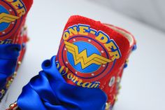 How adorable are these Wonder woman inspired converse! The perfect shoe to complete the look! Please leave your name needed in the notebox during checkout Visit the tutu section or search bar for the matching outfit! If you are unsure of sizing please scroll to the last photos for our size charts, or visit our size charts here--> https://pinktoesnhairbows.com/pages/size-chart All sales are FINAL, Ship dates can be found directly on the listing, please view our policies in detail here---> https:/ Wonder Woman Shoes, Overalls Boys, Tutu Dress Costumes, Bling Converse, Girls Overalls, Girls Converse, Matching Outfit, Birthday Tutu, Search Bar