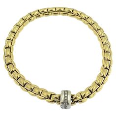 This Fope Flex Bracelet is an exquisite example of luxury and innovation, crafted from a combination of 18-karat yellow and white gold. Known for its flexible and stretchable design, this bracelet offers both elegance and comfort with no clasp, ensuring an easy and secure fit on the wrist. Fope is an iconic Italian jewelry brand renowned for its innovative and luxurious designs. Founded in 1929 in Vicenza, Italy, Fope blends traditional craftsmanship with cutting-edge technology, resulting in distinctive pieces that combine elegance, functionality, and comfort. The brand is particularly celebrated for its Flex'it collection, which features flexible, stretchable bracelets and rings made without clasps, offering a perfect fit and ease of wear. The bracelet features 0.18 carats of brilliant-c Vicenza Italy, Bracelet With Diamonds, Bracelets And Rings, Modern Bracelets, Gold Armband, Italian Jewelry, White Gold Bracelet, Jewelry Brand, Diamond Bracelets