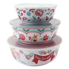 three bowls with floral designs on them are stacked up in the same bowl, and one has