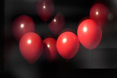 the weeknd album cover with red balloons floating in front of black and white background