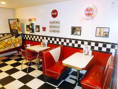 the interior of a diner with checkered flooring