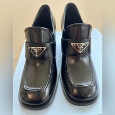 Black Leather Black Square-toe Calf Leather Loafers, Black Square Toe Calf Leather Loafers, Designer Black Loafers For Office, Black Square Toe Loafers For Evening, Designer Black Loafers For Work, Designer Black Pointed Toe Loafers, Prada Loafers, Shoes Brand, Prada Shoes