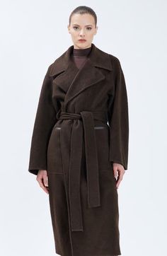 Crafted of a warm wool blend, Nicole Benisti’s coat is cut in a maxi-length oversized silhouette and features a self-tie belted waist. Chest zip pocket Side welt pockets Front flap pocket snap closureBelt loops Removable tie belt Asymemetrical fron zipper closureFits true to size (XS-XL)Model is wearing a size S Wool Coat With Self Belt For Workwear, Belted Long Wool Outerwear, Long Belted Wool Outerwear, Long Wool Belted Outerwear, Long Wool Coat With Self Belt For Work, Belted Long Wool Coat, Fall Wool Coat With Self Belt For Work, Long-sleeve Wool Coat With Self Belt, Brown Belted Wool Coat With Lapel Collar