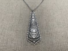 "Unique, funky and stylish boho pendant necklace. It has incredible detail and design. This is a very versatile piece and would be perfect for everyday wear. The pendant measures 2\" long by 3/4\" wide. Made from allergy free plated silver. It hangs from a shiny strong 18\" stainless steel necklace chain with a lobster clasp. I have matching earrings in my shop if you would like the whole set. Here is a direct link https://etsy.me/31dVEuN Thanks for stopping by! Please take a moment and visit th Bohemian Necklace With Large Pendant, Bohemian Pendant Necklaces With Oxidized Finish, Nickel Free Hippie Necklaces For Festivals, Nickel Free Bohemian Necklace For Festivals, Bohemian Pendant Necklace With Oxidized Finish, Bohemian Nickel-free Necklace For Festivals, Nickel-free Bohemian Necklace For Festival, Hippie Style Nickel-free Necklaces For Festivals, Hippie Nickel-free Necklaces For Festivals