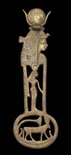 an ancient metal object with a man and dog on it