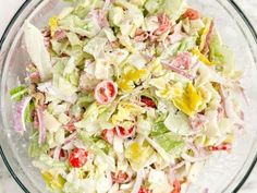 a salad in a glass bowl on top of a table