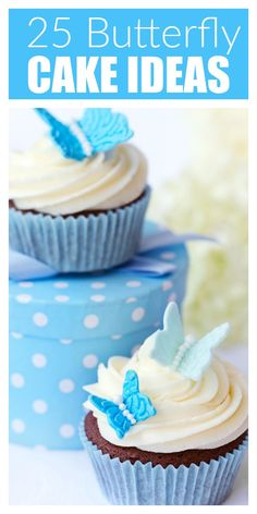 two cupcakes with white frosting and blue butterflies on top are sitting next to each other