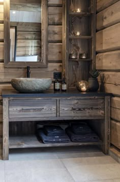 a bathroom with a sink and wooden walls