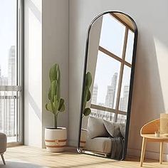 a mirror sitting on top of a wooden floor next to a couch