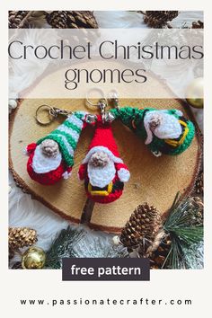 two crochet christmas gnomes are sitting on a piece of wood