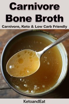 a spoon full of bone broth sitting on top of a wooden table