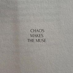 the words chaos makes the muse written in black ink on a white paper sheeted surface