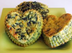 two heart shaped muffins on a green plate