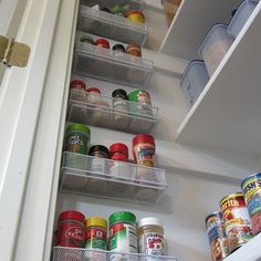 an open refrigerator door with food and condiments in it