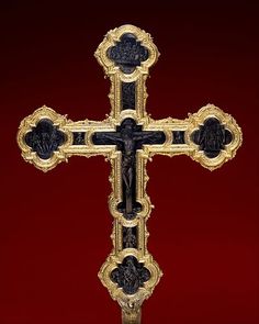 the cross is decorated with gold and black