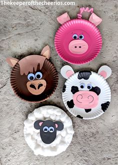 three paper plates with farm animals on them, one is pink and the other is brown