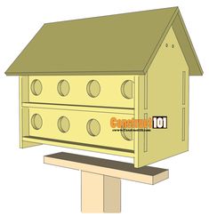 a wooden birdhouse sitting on top of a wooden post with holes in the roof