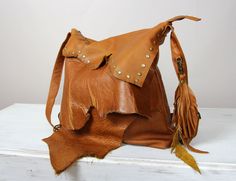 BOHEMIAN Hobo Bag  Fringe leather Large tribal leather raw edges purse hobo, Top Zip Distressed Handbag Dimensions: height: 30 cm (11.8 in) width: 37 cm (14.6 in) strap: max 135 cm (59.1 in) This brown fringe boho handbag  is the perfect size to carry your daily essentials in style!  It is made from high quality italian distressed leather. The purse (flaps in a purse) may differ slightly depending on the edge of the leather. This leather bag is a perfect everyday bag! There is a lot of space and Convertible Tote Bag, Custom Purses, Leather Fringe Bag, Boho Handbags, Work Handbag, Leather Backpack Purse, Fringe Bags, How To Make Handbags, Leather Hobo Bag