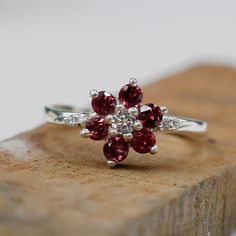 D E S C R I P T I O N  ✦Main Stone :- Rhodolite Garnet ✦Shape :- Round ✦Cut :- Faceted ✦Color :- Red ✦Metal :- 925 Sterling Silver ✦Natural :- Yes ✦Finish :- Rose Gold, Gold, Silver, Black  Every item will be delivered with a nice gift box Customization is available, We can also make it with 14k, 18k solid gold (white or yellow or rose) and diamond accent stone, just feel free to contact us. IMPORTANT: * Customer service is available 7 days a week * For wholesale discounts Feel free to contact us * All jewelry items will be delivered nicely packaged with a fancy gift box. *The stones may vary slightly in color, due to reflection We Offer professionalism, quality, and reliability.   We would highly appreciate Your Response. Thank you very Much for Visiting Our Shop. Hope you enjoyed visitin Rhodolite Garnet Ring, Silver Engagement Ring, Fancy Gifts, January Birthstone, Garnet Ring, Rhodolite Garnet, Garnet Rings, Gold Gold, Gemstone Ring