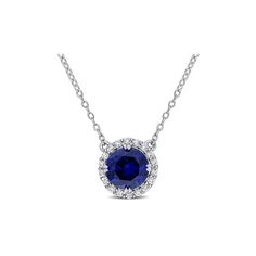 This graceful lab-created blue and white sapphire halo pendant necklace is an elegant piece of jewelry. Crafted in lustrous sterling silver, this beaded necklace features one round cut, prong set created blue sapphire gemstone (8x8mm) and 18 round cut, prong set white sapphire gemstones (1.5x1.5mm). Enhanced with a polished finish, this exquisite pendant is suspended on an 18-inch round cable chain secured with a spring ring clasp.Wear it alone or layer it with other longer pieces to elevate the Blue Sapphire Gemstone, Halo Pendant, Sapphire Gemstone, White Sapphire, Spring Rings, Cable Chain, Prong Setting, Blue Sapphire, Round Cut